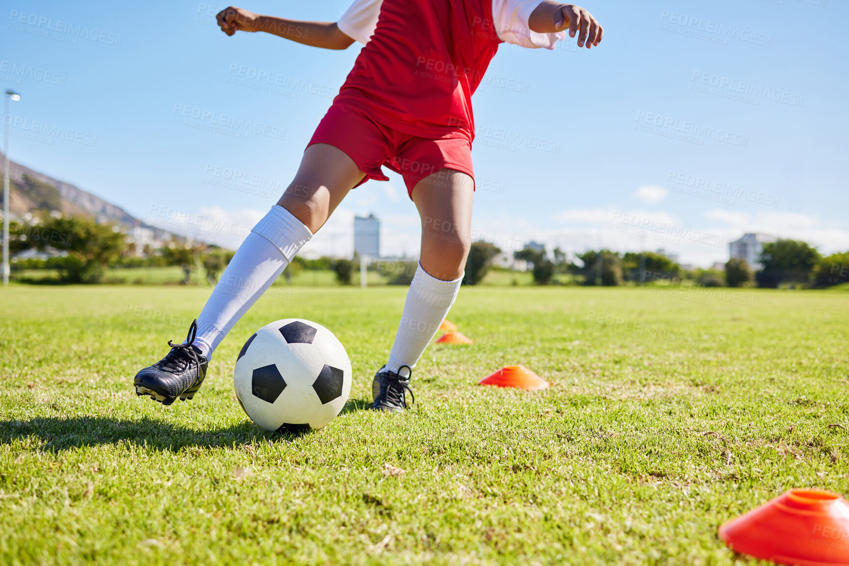 Buy stock photo Soccer kid, field and training for sport fitness, balance and control with speed, body health and development. Cropped football player child, fast dribbling and exercise feet on pitch with commitment