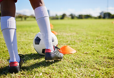 Buy stock photo Closeup football kid, grass and training for fitness, sports and balance for control, speed and development. Young soccer player, fast dribbling or exercise feet on grass with cleats in low angle