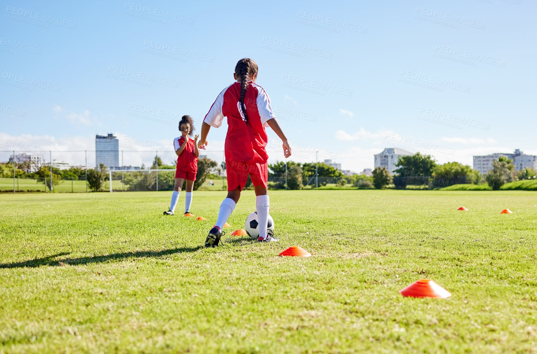 Buy stock photo Soccer, running or sports and a girl team playing with a ball together on a field for practice. Fitness, football and grass with kids training or dribbling on a pitch for competition or exercise