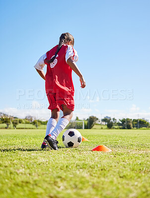 Buy stock photo Sports, training and girl playing soccer for fitness, physical activity and hobby on a field in Spain. Active, focus and athlete dribbling a football for a game, cardio and match on the grass