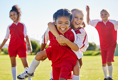 Buy stock photo Soccer, girl celebration and field with happy piggyback, team building support and solidarity for winning game. Female kids, sports diversity and celebrate with friends, teamwork and goal in football