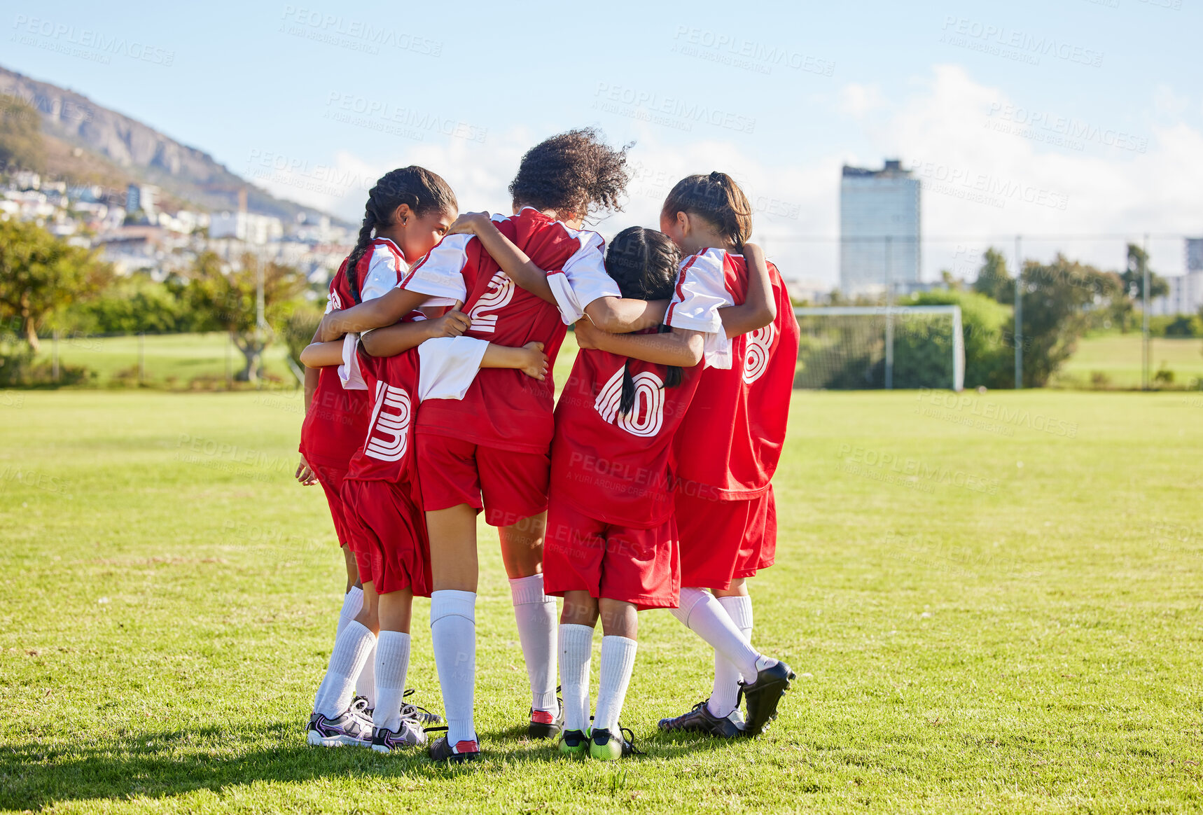 Buy stock photo Diversity, sports girl hug and soccer field training for youth competition match playing at stadium grass. Team, young athlete or player enjoy football teamwork or support world cup championship