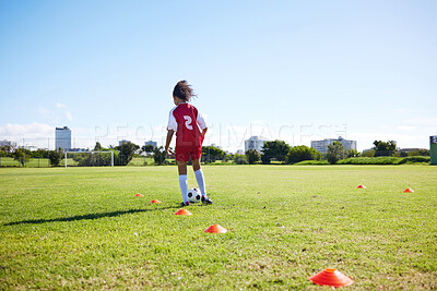 Buy stock photo Soccer, mockup or sports and a girl training alone with a ball on a field for practice or skill. Fitness, football and grass with a kid running or dribbling on a pitch for competition or exercise