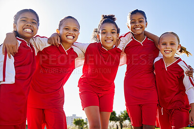 Buy stock photo Football girl, group portrait and field for smile, team building happiness and solidarity at sport training. Female kids, sports diversity and friends with teamwork, learning or soccer with low angle