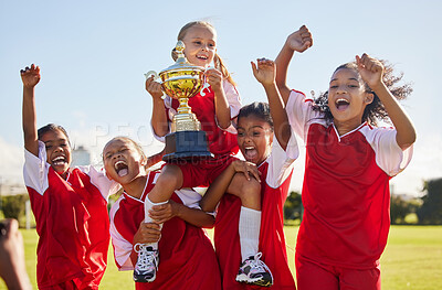 Buy stock photo Football, team and trophy with children in celebration together as a girl winner group for a sports competition. Soccer, teamwork and award with sport player kids celebrating success outdoor