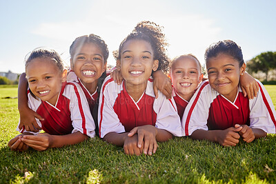Buy stock photo Girl, soccer group portrait and lying with smile, team building happiness or solidarity to relax at training. Female kids, sports diversity and happy with friends, teamwork or development in football