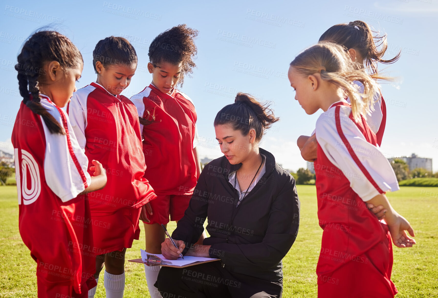 Buy stock photo Planning, sports and coach with children for soccer strategy, training and team goals in England. Plan, teamwork and woman coaching a group of girls on football for a game, match or competition