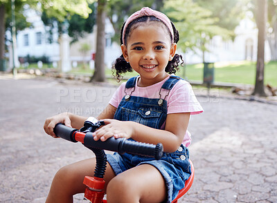 Buy stock photo Portrait, young girl on bike in park and happy child outdoor with nature and freedom, smile while riding. Travel, happiness and adventure, growth and childhood with family day out and cycling mockup