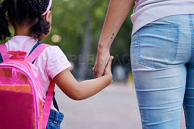 Buy stock photo Holding hands, mother and child walking to school, help and care with support outdoor, education for knowledge and growth. Development in childhood, backpack and family, woman with girl and back view