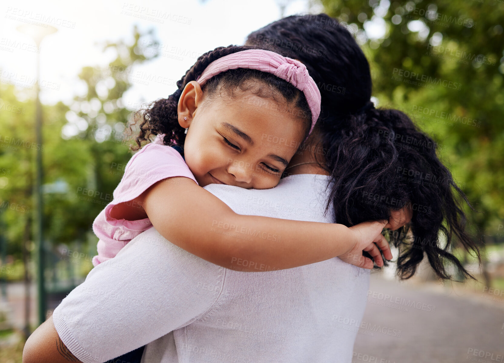 Buy stock photo Hug, park and mother and daughter, love and sweet while bonding outdoor together. Black woman, embrace and fun in a forest, precious and happy, content and relax in a beautiful moment of motherhood