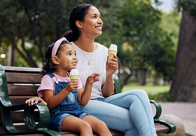 Buy stock photo Summer, park and ice cream with a woman and girl bonding together while sitting on a bench outdoor in nature. Black family, children and garden with a mother and daughter enjoying a sweet snack