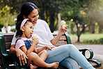 Summer, park and ice cream with a mother and girl bonding together while sitting on a bench outdoor in nature. Black family, children and garden with a woman and daughter enjoying a sweet snack