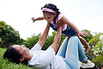 Black family, park and flying with a woman and girl having fun together while bonding on grass outdoor. Kids, love and nature with a mother and daughter playing in a nature garden outside in summer