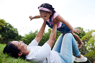 Buy stock photo Black family, park and flying with a woman and girl having fun together while bonding on grass outdoor. Kids, love and nature with a mother and daughter playing in a green garden outside in summer