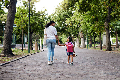 Buy stock photo Walking, park and mother holding hands with girl on journey for back to school, learning and class for first day. Love, black family and mom with child walk for kindergarten, education and play date