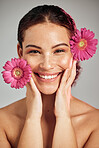 Flowers, skincare and face portrait of a woman with natural beauty and a smile for dermatology. Facial, wellness and self care for skin glow, nature cosmetics or makeup of a healthy model in studio