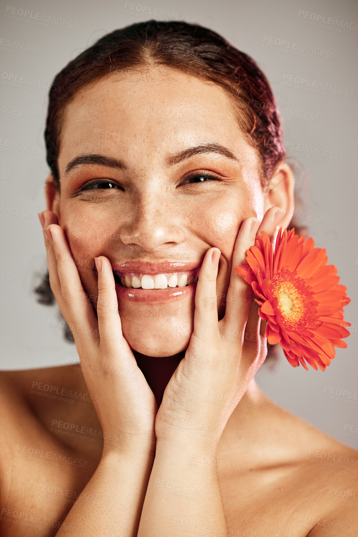 Buy stock photo Happy portrait, beauty face and flower for skincare woman with dermatology and cosmetic. Floral facial, wellness and self care for freckles skin glow, healthy teeth and natural makeup model in studio