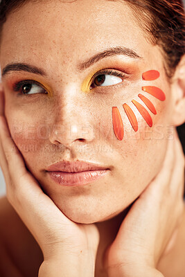 Buy stock photo Face, makeup and flower petal on woman skin for beauty with dermatology and cosmetic. Facial, wellness and self care for freckles with floral product and creative orange color on natural studio model