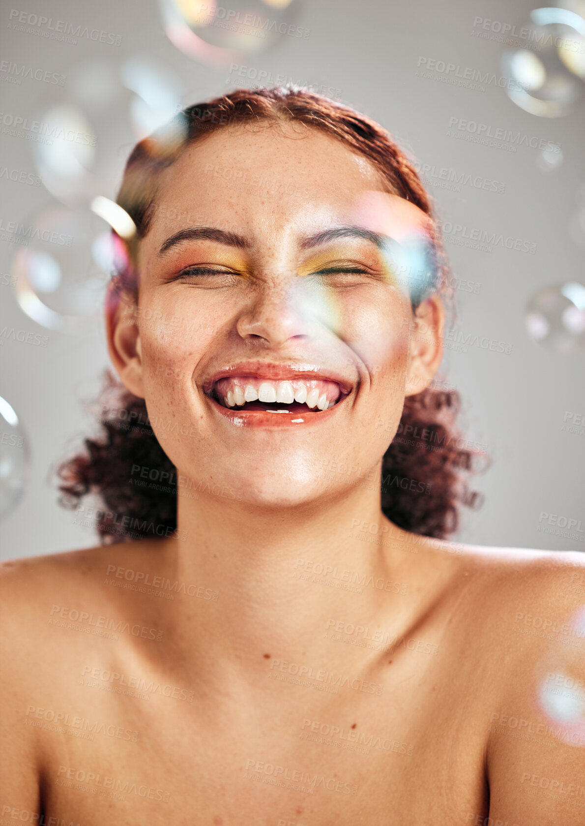 Buy stock photo Bubbles, happy face and beauty woman in studio for skincare cosmetics, natural skin and dermatology. Facial makeup, health and wellness of comic model person with luxury body product glow and peace
