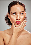 Beauty, face and woman lips with lipstick and makeup, skin and natural cosmetics with red isolated on studio background. Kiss, pout and hand with manicure, spa treatment and glow with cosmetic care