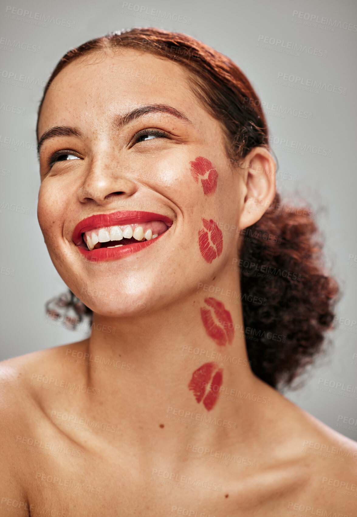 Buy stock photo Makeup, red lipstick and kiss on face of woman model in studio for cosmetics, love and happiness. Beauty headshot of person happy for valentines day spa facial skin idea or skincare motivation