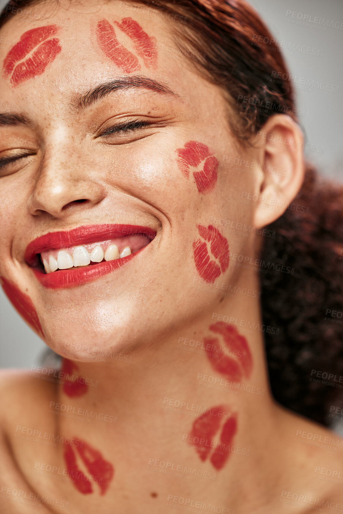 Buy stock photo Face, red lipstick kiss and makeup on face model woman in studio for cosmetics and happiness. Headshot of aesthetic person happy about love for valentines day spa facial or skincare motivation
