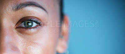 Buy stock photo Eye, face and mockup with woman in portrait, vision and eye care with ophthalmology isolated on blue background. Eyebrow, future and perception, contact lens and lashes, awareness and focus in studio