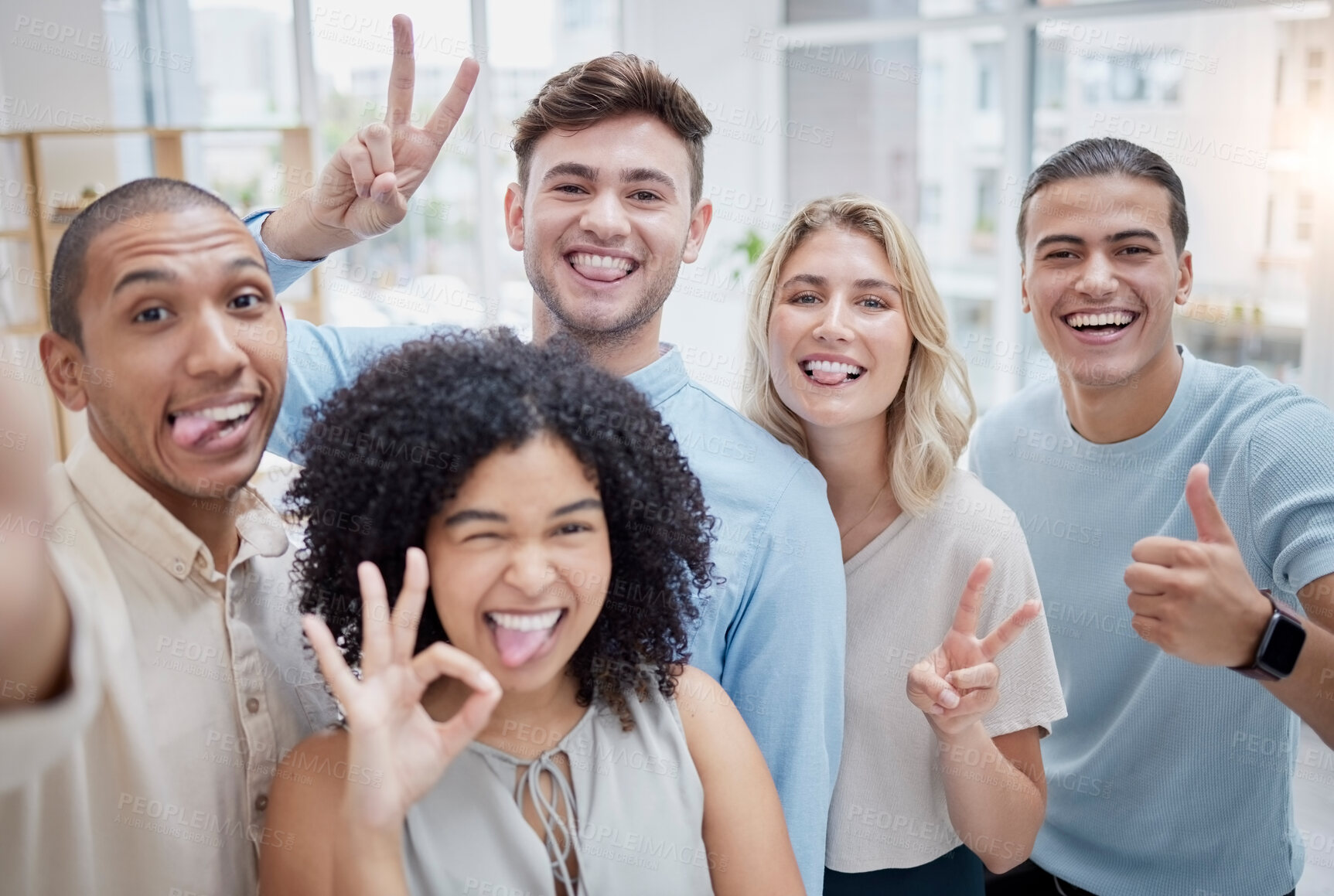 Buy stock photo Peace sign, thumbs up and selfie of business people in office. Comic face, portrait or group of friends or workers with tongue out and hand gestures, taking pictures for social media or happy memory
