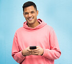Happy man, portrait or phone typing on isolated blue background on social media, fashion app or city internet. Smile, person or student model on mobile communication technology by Brazil wall mockup