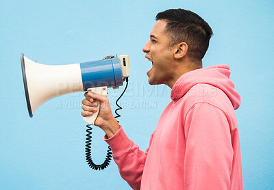Buy stock photo Man, speaker and megaphone in studio for justice, microphone speech and communication in blue background. Male shouting, protest announcement and audio information with voice broadcast for change