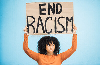 Buy stock photo Black woman protest, sign and angry at racism, fight for equality, human rights and freedom isolated on blue background. Global problem, social justice and revolution, anger in studio and politics