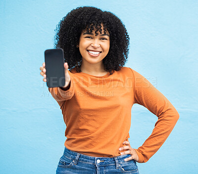 Buy stock photo Happy black woman, portrait or phone screen mockup on isolated blue background in social media app or web design. Smile, student or model on technology mock up, city contact communication or branding
