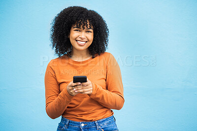Buy stock photo Happy black woman, fashion or phone typing on isolated blue background on Brazil city app, social media or internet. Smile, person or student model on mobile communication technology by wall mock up