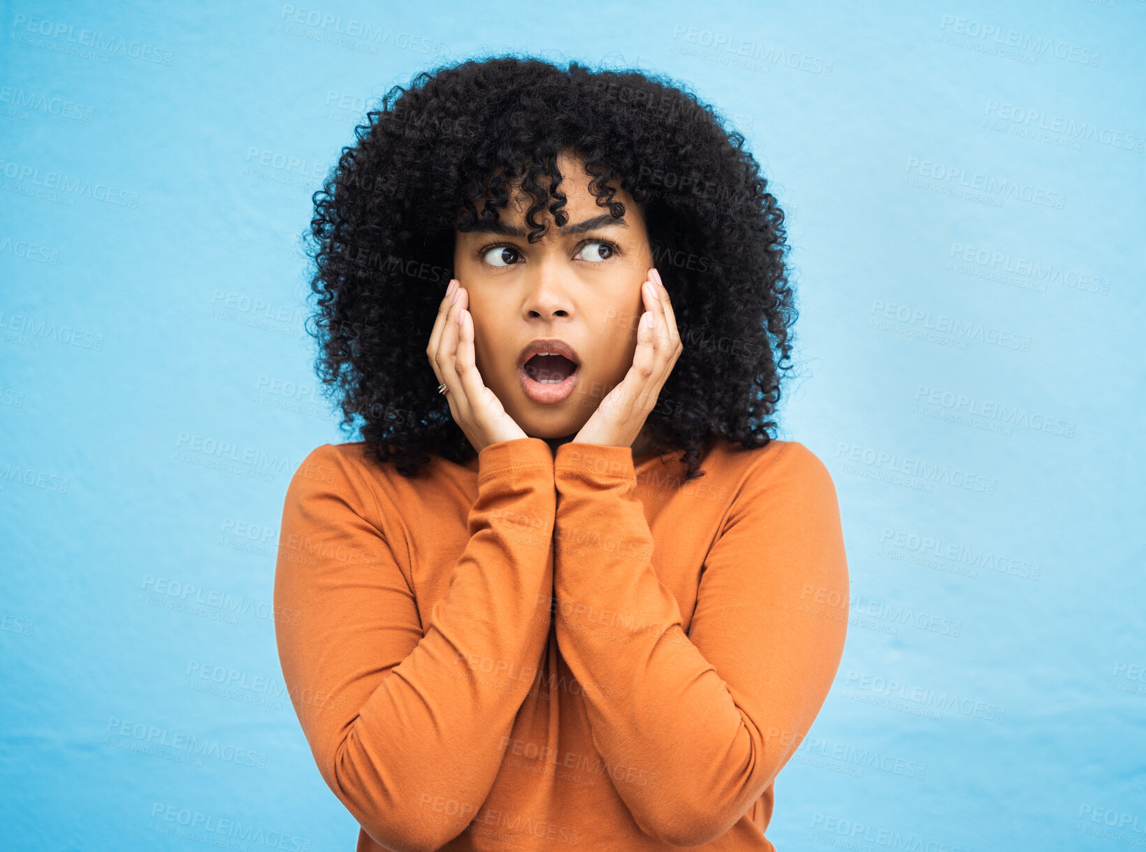 Buy stock photo Wow, surprise and idea with a black woman in shock standing on a blue background in studio. Omg, confused and thinking with an attractive young female looking shocked or surprised indoor