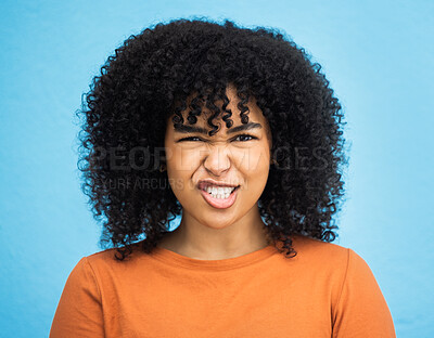 Buy stock photo Portrait, emoji and woman with facial expression in studio for fun, relax and playful attitude on blue background. Face, comic and goofy black woman with a funny face, crazy and personality isolated