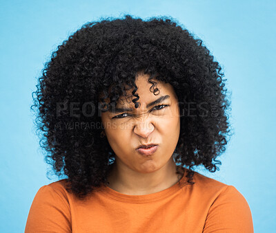 Buy stock photo Black woman, portrait or angry facial expression on isolated blue background in mental health burnout. Headshot, model or person with mad, annoyed or frustrated face on backdrop mockup with afro hair