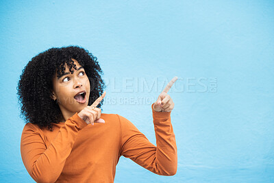 Buy stock photo Black woman, wow or pointing hands at promotion mockup, advertising space or marketing mock up on blue background. Surprised, shocked or curious afro model with showing gesture at isolated sales deal