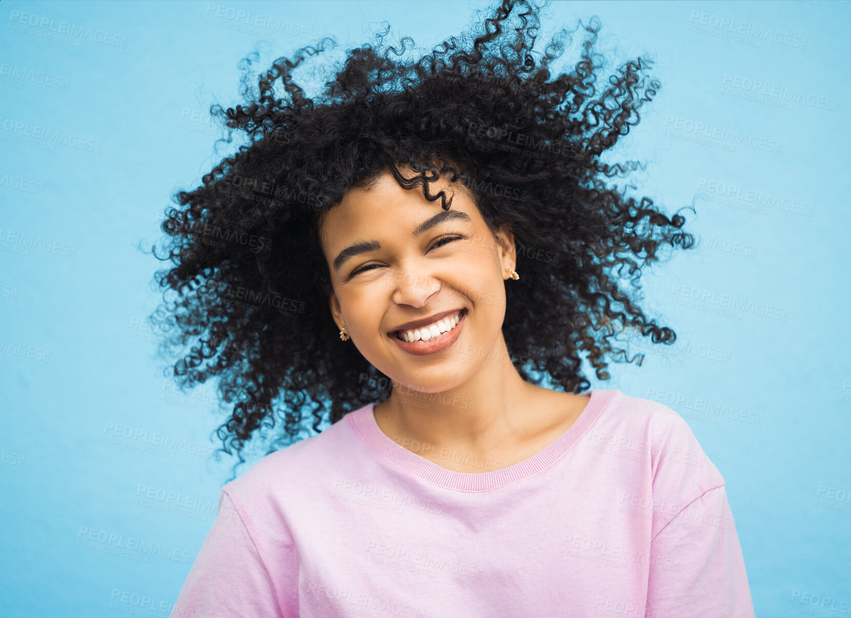 Buy stock photo Shake hair, happy face portrait and black woman with healthy shampoo hairstyle, studio beauty or facial skincare. Cosmetic makeup, spa salon and afro girl from Brazil isolated on blue background wall