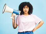 Megaphone announcement, serious and portrait of black woman protest for democracy vote, justice or human rights rally. Racism speech, microphone noise and studio speaker isolated on blue background