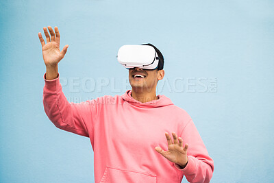 Buy stock photo Vr, headset or metaverse fun on isolated blue background for ai esports, gaming cyber world or futuristic fantasy game. Smile, happy man or virtual reality with hands touching in digital software ar 