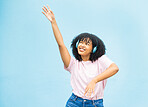 Wall, black woman and dance with smile, celebration and relax on blue studio background. African American female, lady and dancing with headphones, movement and excited with casual outfit on backdrop