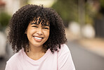 Black woman, smile and portrait of a young person happy in a urban city street with mockup. Happiness, freedom and excited face of a female in summer ready for travel smiling with mock up space