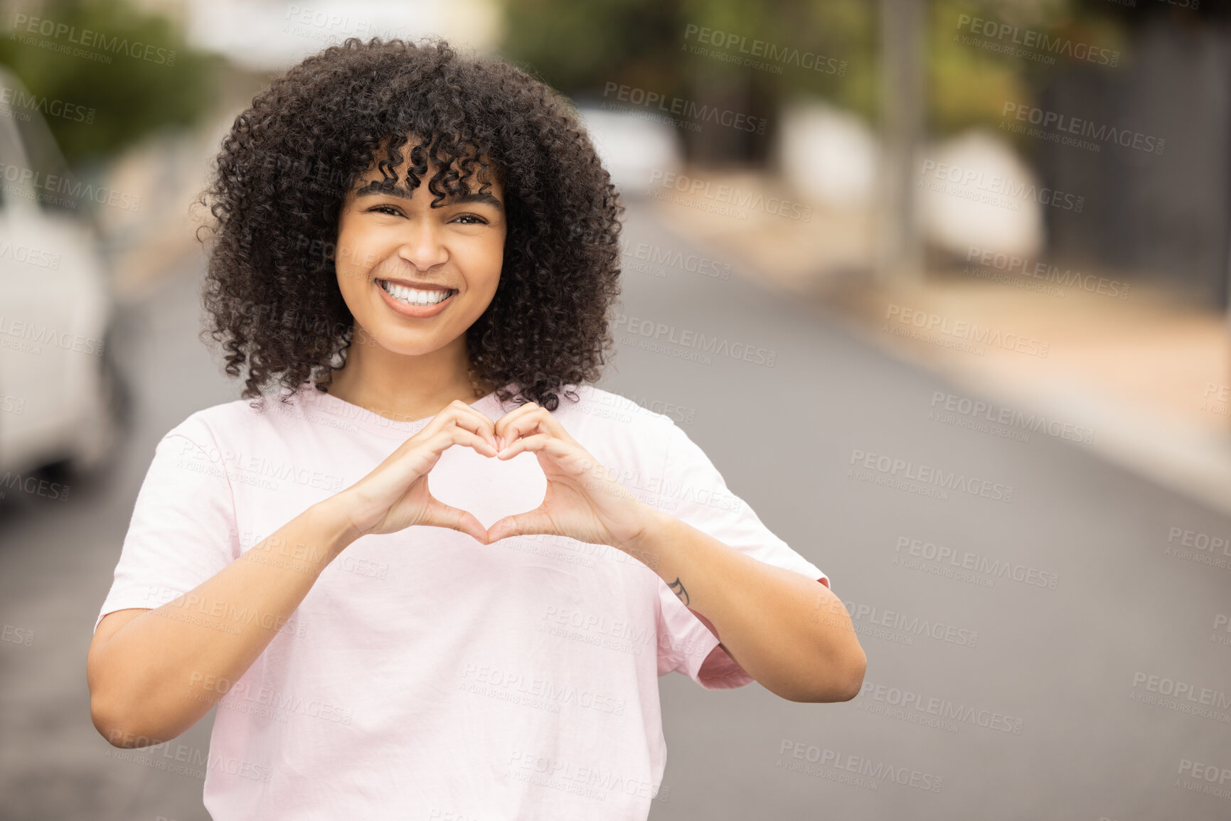 Buy stock photo Heart hands sign, black woman and portrait of a young person in a urban street showing love gesture. African female, happiness and smile with mock up space with hand making emoji shape outdoor