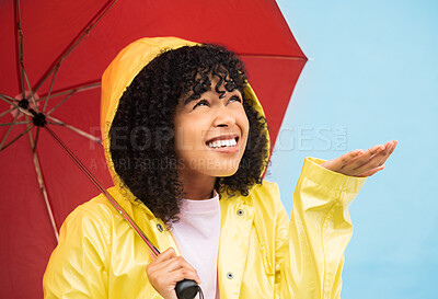 Buy stock photo Black woman, umbrella or hand catching rain on isolated blue background in Brazil city. Person, student or checking for weather water drops in rainfall anxiety, curious or wondering facial expression