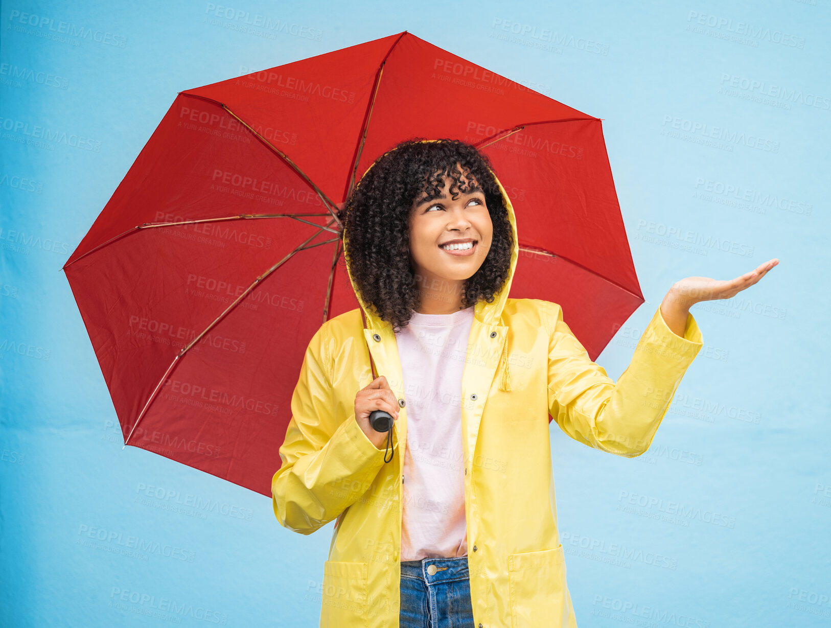 Buy stock photo Travel, rain and woman with umbrella in a city, having fun and solo trip on wall background. Weather, hand and girl traveler enjoying rainfall, touching and excited, feeling and standing isolated 