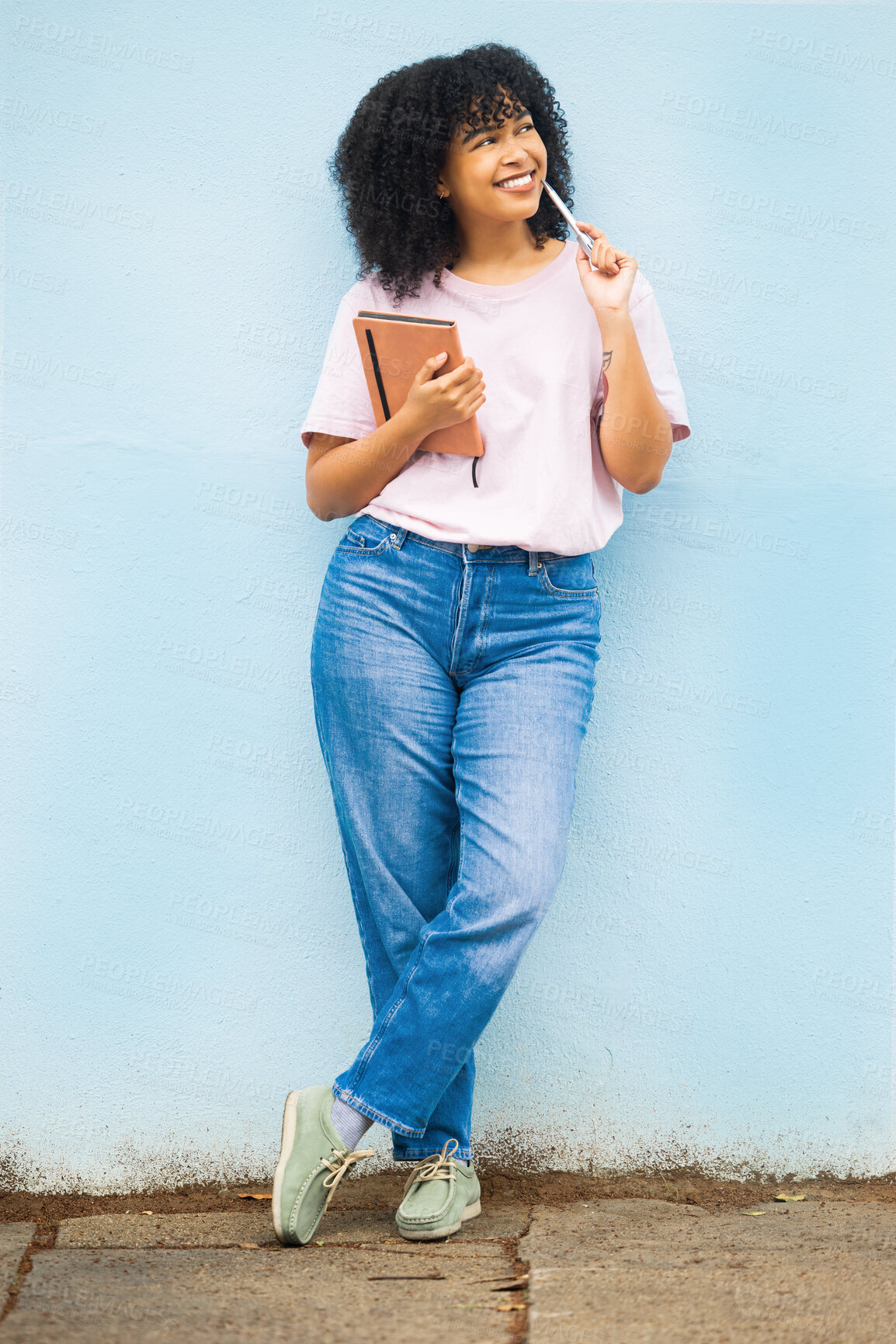 Buy stock photo Wall, black woman and writer thinking, creative decision and focus for ideas, notes and happiness. African American female, young person and student with pen, daydreaming and notebook for project