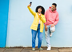 Happy couple, peace sign or phone selfie on isolated blue background for social media, profile picture and travel vlog. Smile, man and black woman bonding for on mobile photography technology in city