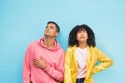 Buy stock photo Thinking, mockup and fashion with a black couple on a blue background in studio branding or product placement. Wall, style and mock up with a man and woman posing on blank space in trendy clothes 