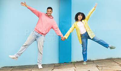 Buy stock photo Happy, smile and happy couple holding hands in the city street doing a silly, fun and goofy pose. Happiness, love and young man and woman with affection standing in a road in town on a walk in Mexico
