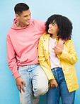 Couple of friends, bonding and hug on isolated blue background in fashion, afro hair trend and cool style clothes. Smile, happy man and black woman in embrace on wall mock up backdrop in Brazil city